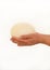 Male hands holding of big ostrich egg on white background, size comparison, close up. Organic fresh egg. Healthy food. Ostrich egg