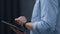 Male hands holding digital tablet computer close up. Manager working online.