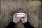 Male hands holding a white blank thank you on sheet of paper