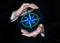 Male hands keeps digital compass wind rose. Travel and worldwide business concept.