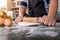 Male hands kneading dough sprinkled with flour table, Hands prep