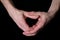 Male hands making heart gesture on black background, isolated image, love confession concept, relationship symbol, valentine`s da