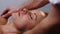 Male hands massaging woman\'s neck