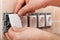 Male hands mounting electrical wall socket - closeup