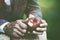 male hands peeling apple with knife