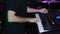 Male hands playing the grand piano. Man composer touching keys with fingers. Close-up shot. Male hands playing music on