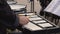 Male hands playing music on metallophone on outdoor concert. Musian playing melody on glockenspiel on street performance