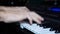 Male hands playing the piano. Man composer touching keys with fingers. Close-up shot. Male hands playing music on piano