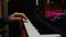 Male hands playing piano midi keyboard in home music studio. Sound producer creating pop rock songs in studio. Close up hands play