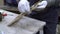 Male hands polishing cleaning wooden frame in woodcraft studio