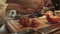 Male hands preparing paprika on a wooden cooking board