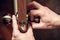 Male hands repairman fix a door handle