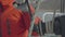 Male hands of sailor man reel up ropes on board sailing yacht close up