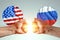 Male hands show their fists against the background of the flags of America and Russia. The concept of power struggle, conflict of
