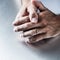 Male hands showing proof of engagement in displaying wedding ring