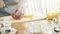 Male hands slicing red paprika on a wooden cutting board