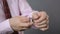 Male hands taking off expensive mechanical wrist watch, businessman undressing