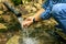 Male hands typing in her hands clean spring water