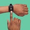 Male Hands Using Smartwatch Voice Assistant Over Green Studio Background