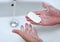 Male hands washing with soap water