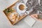 Male hands writing post card on the stone table with cup of coffee and cookie. Business with love concept