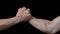 Male handshake. Gestures. Black background. Man\'s hands. Greetings and farewell.