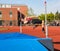 Male High school athlete tries to clear bar in high jump in track meet