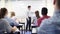 Male High School Tutor At Whiteboard Teaching Science Class