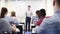 Male High School Tutor At Whiteboard Teaching Science Class