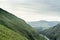 Male hiker against the skyline, showing the scale of Thorpe Cloud, Peak District, Derbyshire