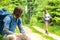 Male hiker looking back waiting the girl