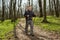 Male hiker looking to the side walking in forest