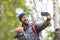 Male hiker make a selfie with mobile phone.