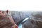 Male hiker overlooking Horseshoe Bend at sunset, Arizona, USA