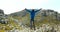 Male hiker standing with arms outstretched in countryside 4k
