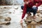 Male hiker testing water