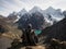 Male hiker in traditional poncho Cordillera Huayhuash Circuit andes mountain San Antonio pass Laguna Jurau Huanuco Peru
