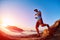 Male hiker, traveler runs on the trailagainst sea and blue sky