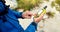 Male hiker using digital anemometer to check the weather 4k