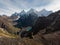 Male hiker in yellow jacket at Cordillera Huayhuash Circuit andes mountain San Antonio pass Laguna Jurau Huanuco Peru