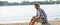 Male hipster on a beach panorama