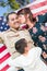 Male Hispanic Armed Forces Soldier Celebrating His Return Holding American Flag