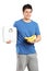 Male holding a weight scale and bananas