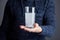 Male holds glass of water with dissolved pill