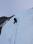 Male ie climber on a steep ice fall near Lax in Switzerland