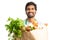 Male indian employee holding paper bag with groceries