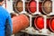 Male industrial worker puts a gas cylinder into a gas machine. Equipment for the safe transportation of propane gas bottles