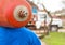 A male industrial worker walks with a gas cylinder to a gas car. Transportation and installation of a propane bottle to