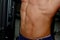 Male inflated belly with pres cubes close up. Gym. Body-builder. Beautiful, swollen male body. Trainer, advertising, healthy