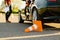 Male instructor at the car, downed traffic cone